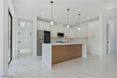 Kitchen with appliances with stainless steel finis