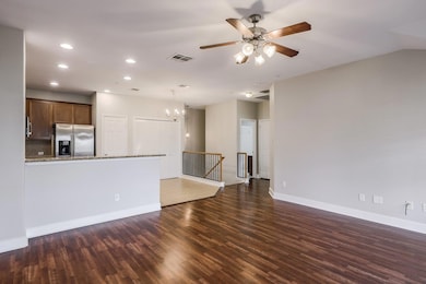 Unfurnished living room with a chandelier, wood f