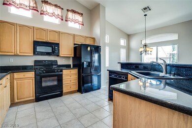 Kitchen features granite countertops, breakfast ba