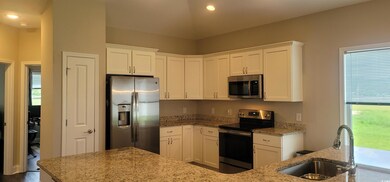 Kitchen featuring appliances with stainless steel 
