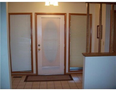 Other. Foyer ... two side light windows add extra light to the large entry way.