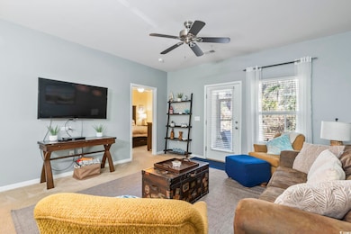 Living area featuring baseboards, visible vents, c