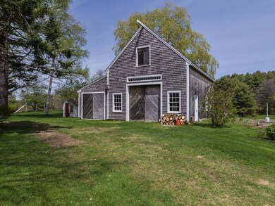 The detached barn is of recent...