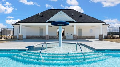 Community pool featuring a patio and ceiling fan