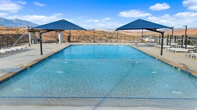 Community pool with a mountain view and a patio