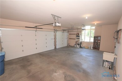 Features of 3-car garage:  opener, sink, service d