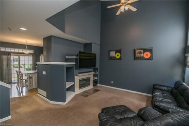 Living room with vaulted ceilings, fireplace and c
