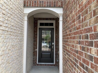 Property entrance with brick siding