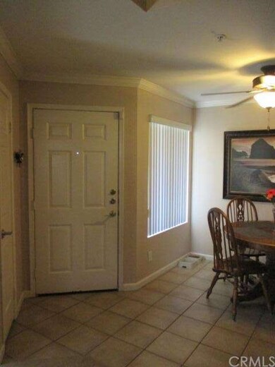 Entry into condo to left is small coat closet to t