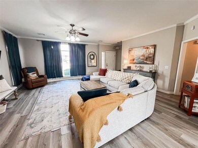 Living room featuring light wood-type flooring, or