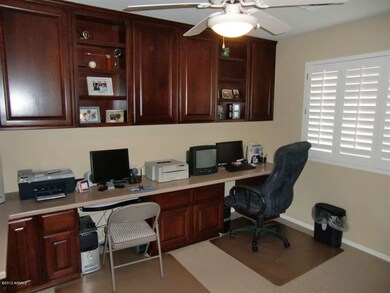 BUILT IN CHERRY CABINETS in Den