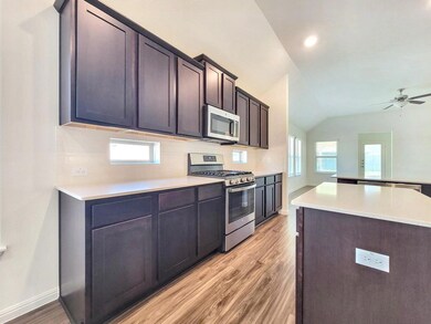 Kitchen featuring appliances with stainless steel