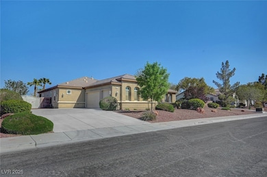View of front of property with an attached garage, fence, stucco siding, a gate, and driveway