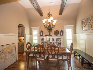 Formal dining has hardwood floor, beamed and vault