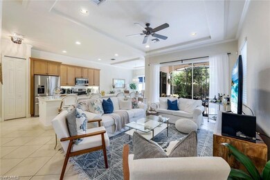 Tiled living room with crown molding and ceiling f