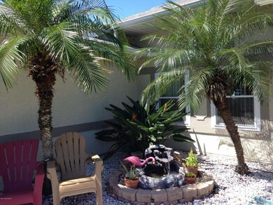 TROPICAL ENTRYWAY WITH WATERFALL