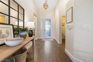 Entryway with dark wood-style flooring, baseboards