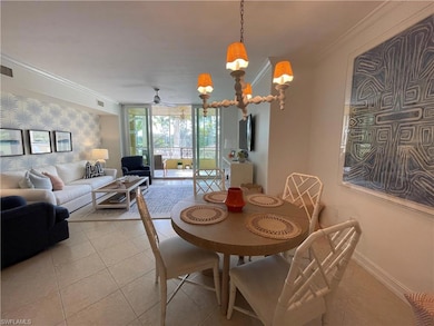 Dining space with baseboards, light tile patterned