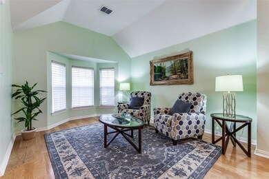 Living area with light hardwood / wood-style floor