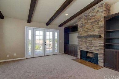 Family room open to kitchen and features an impres