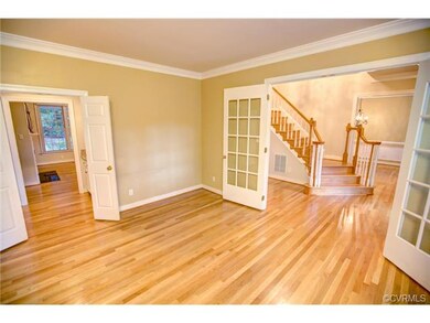 Formal Living room looking into foyer and wet bar 