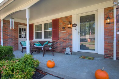 The large covered front porch greets you and is a 