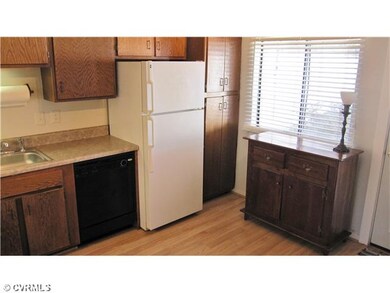 Kitchen - Large window and french doors open to pr