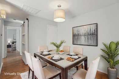 Dining room featuring wood finished floors, baseb