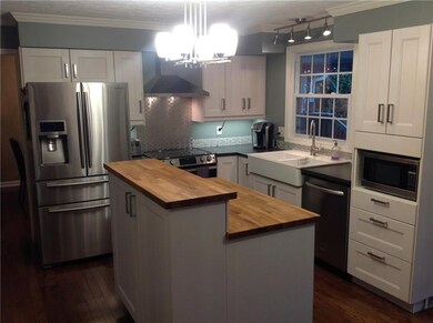 Kitchen features stainless steel appliances, oven 