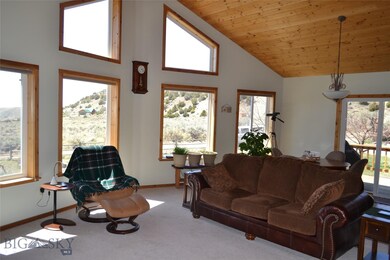 Living and dining area with large windows for amaz