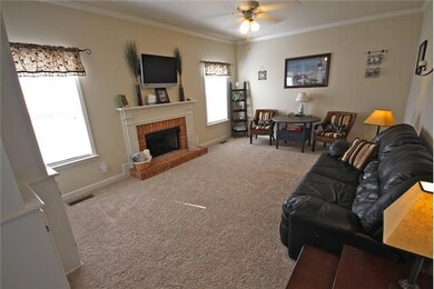 Living Room with Fireplace, Custom Built-ins and Built-in TV Wiring.