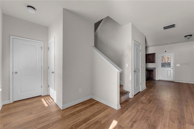 Hallway featuring light hardwood / wood-style flooring