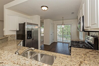 KITCHEN FROM BAR AREA FROM LIVING RM. AND SECOND F