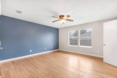 Spare room with ceiling fan, light wood-type floor