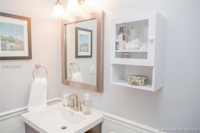 This is the updated bathroom! There is a tub on th