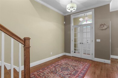 Foyer past 2 sets of Double front doors