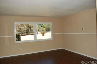 The living room windows offer a nice view of the p