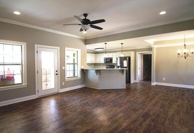 Open concept floor plan with lots of lighting.