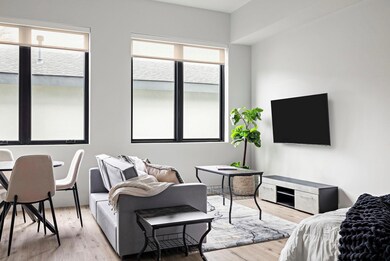 Living area with light wood-type flooring