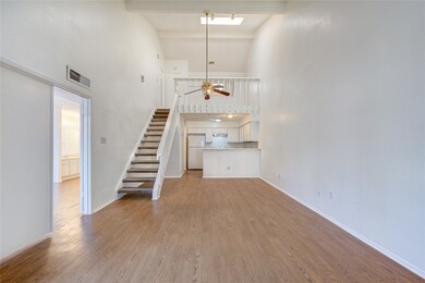A view of the living space showing the staircase.