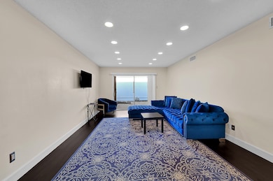 Large living room with laminate wood floors and re