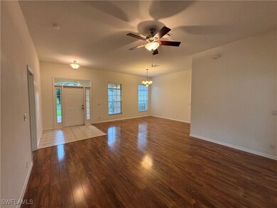 Foyer entrance featuring hardwood / wood-style flo