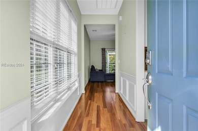 Corridor with a textured ceiling and dark hardwood