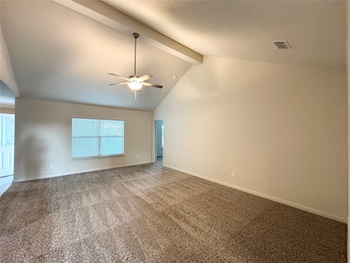 Empty room with beam ceiling, carpet floors, high vaulted ceiling, and a ceiling fan
