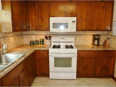 Kitchen - Gas range, microwave, dishwasher and ref