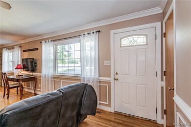 Foyer entrance featuring light hardwood flooring a