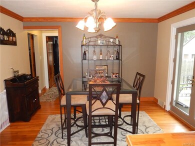 DINING ROOM WITH HARDWOOD FLOORS, CROWN MOLDING & 