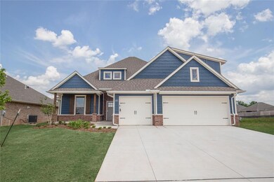 Craftsman house featuring central AC, a front lawn