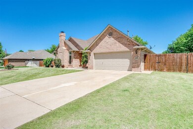 View of front facade with a garage and a front law