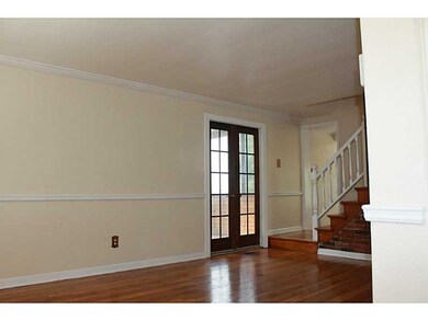 Exterior Front. Living room with gleaming hardwood